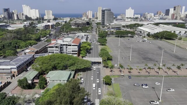 Drone flies east along M4 Bram Fischer Road on sunny day in downtown Durban, South Africa