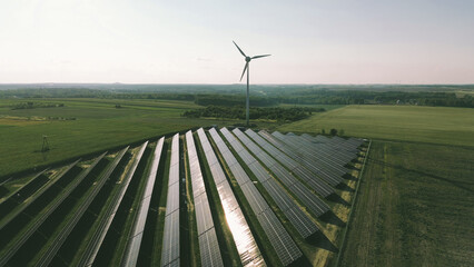 Wind turbine and solar panels generating clean power © AlexGo