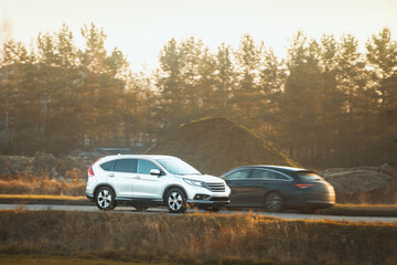 Family vehicle driving on highway through countryside
