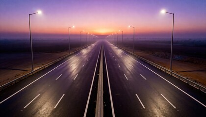 Expansive highway stretching into the horizon at dawn, illuminated by streetlights, with a misty atmosphere and vibrant colors of sunrise reflecting on the wet asphalt, creating a serene travel scene