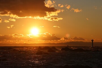 The sea dyed orange by the setting sun