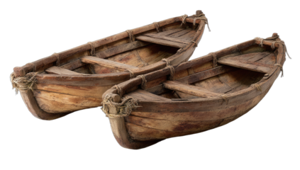 Two weathered wooden rowboats resting side-by-side on a dark background