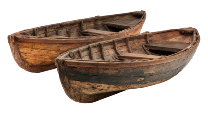 Two weathered wooden rowboats, isolated against a dark background