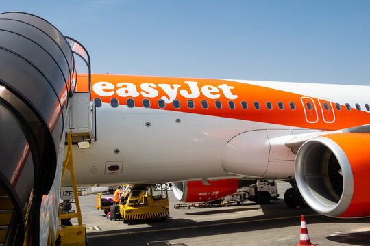 EasyJet flight low angle view at Cristiano Ronaldo International airport in Madeira Island, Portugal.