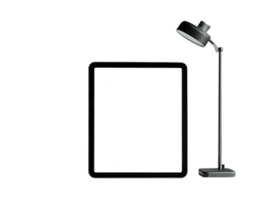 Modern digital tablet and adjustable desk lamp on black