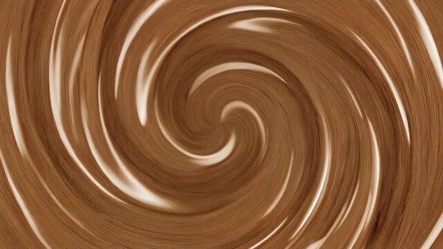 Swirling pattern of chocolate brown liquid with creamy highlights.