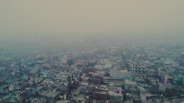 4K Aerial Drone View of Pale Sun Struggling Through Thick Toxic Smog and Haze Over Ghaziabad, Uttar Pradesh, India &ndash; High AQI