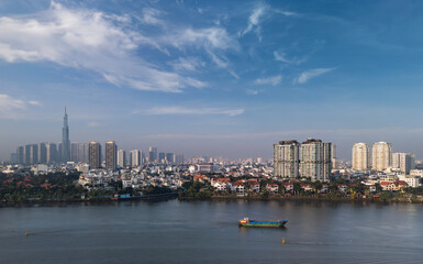 Aerial view of Ho Chi Minh City Skyline and Saigon River waterfront from Thao Dien in early morning on sunny clear day.
