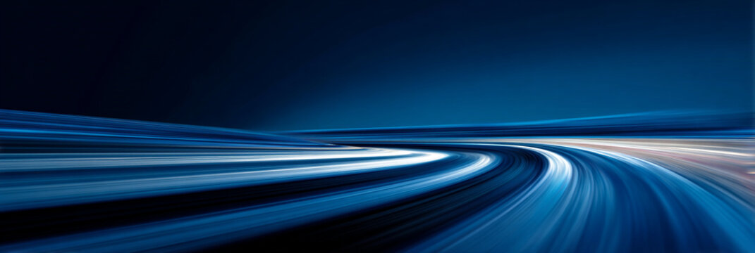 Futuristic blue light trails with high speed motion blur on dark background