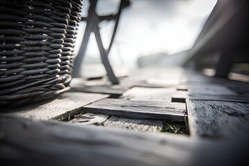 Wicker basket sits on rustic, weathered wooden dock