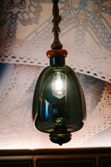 Elegant Decorative Glass Pendant Light Illuminating Ornate Ceiling