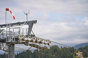 The support of the cable car over the large gorge of Oi-Karagai. Mountainous terrain.