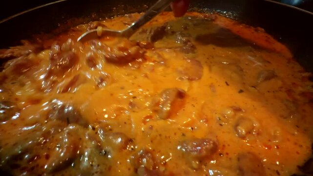 Beef Stroganoff Simmering in Creamy Tomato. Meat Stew Cooking 
