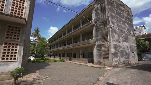 Wide courtyard inside Tuol Sleng prison complex revealing classrooms converted into detention spaces, , Khmer Rouge Genocide