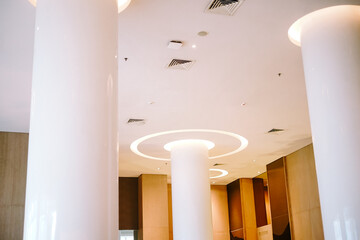 Modern Interior Design with Bright White Columns and Ceiling Lights