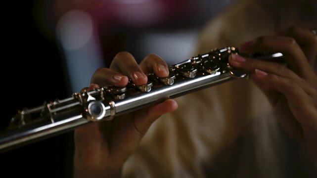 Cinematic Close Up of Musician Playing Silver Flute in rehearsal studio music