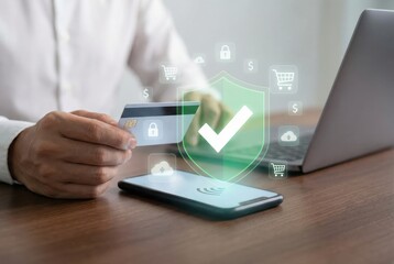 Secure online shopping and digital payment protection with credit card, laptop, and smartphone on a wooden desk