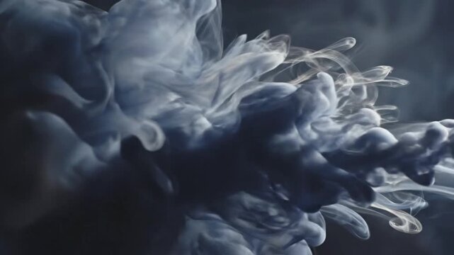 A captivating abstract visual features delicate white and light gray smoke or ink gracefully billowing and diffusing within a deep, dark space. The fluid motion creates intricate, organic tendrils and