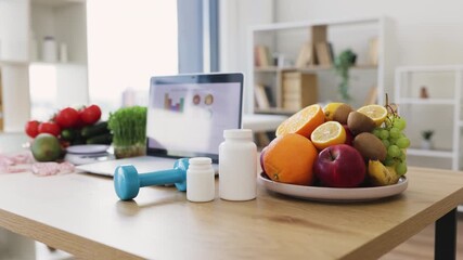 A vibrant display of healthy eating and fitness, featuring fruits, vegetables, supplements, and exercise equipment.