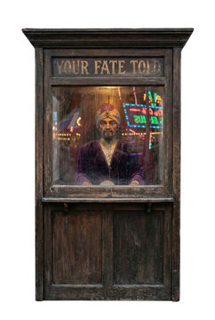 Vintage fortune teller machine booth with mannequin. Arcade amusement game.