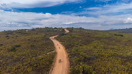 Drone panorama of Paarl mountain nature reserve above the city of Paarl in South Africa. Cloudy day with visible lake and fynbos vegetation dominated by massive rounded granite rock formations