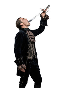 Sword swallower performing stunt in profile. Vintage circus act.