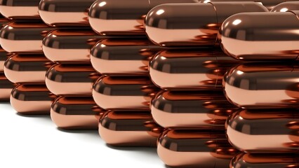 A stack of shiny copper capsules on a white surface