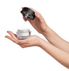 Woman's hands holding an open transparent jar containing white cream, presenting a beauty product for skincare, hydration, and cosmetic treatment on a clean background