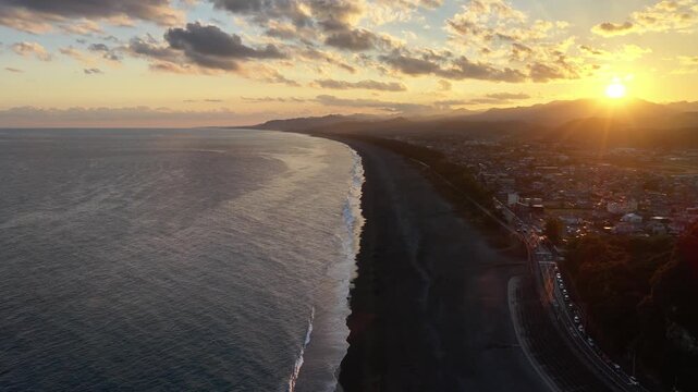 Forward-Flying Drone Shot of Kumano Shichirimihama Beach at Sunset, Japan
