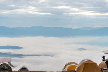 Camping tents in the mountains, and morning mist.