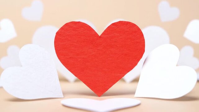 A vibrant red texture heart cutout centered on a warm peach backdrop, surrounded by scattered white hearts, captured from a front-facing viewpoint for Valentine-themed illustration design