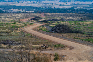 Winding Dirt Road Through Vast Open Landscape