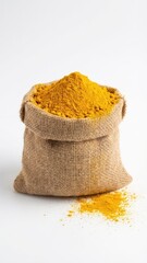 small burlap bag packed high with vibrant golden turmeric powder studio shot