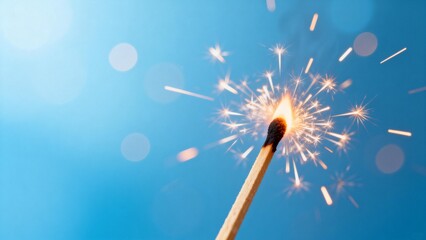 Burning match with sparkles