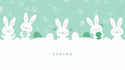 Adorable Easter bunnies with eggs in spring