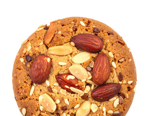 A close-up view of a baked, round biscuit studded with nuts and seeds, isolated