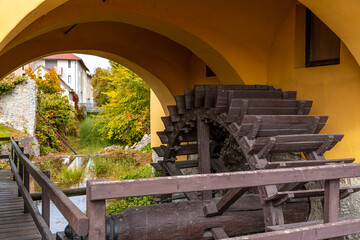 Old, traditional water mill wheel at old lake Tata city, Hungary, Europe