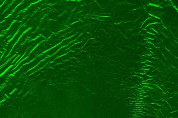 Vector green foil texture background. Abstract gradient bright and shiny light reflection rough texture surface. Vector illustration for background, backdrop, web, wallpaper