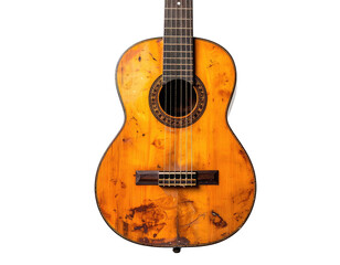 Obraz premium Close-up of a well-worn classical acoustic guitar against a black backdrop