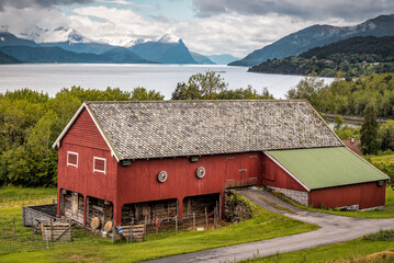Wooden Scandinavian farm near beautiful fjord