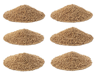 Piles of golden-brown lentil-like seeds arranged in multiple small mounds