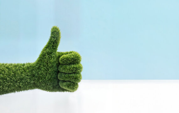 main pouce en l'air en texture d'herbe verte, isol&eacute; avec espace vide pour du texte, concept d'&eacute;cologie et transition &eacute;nerg&eacute;tique