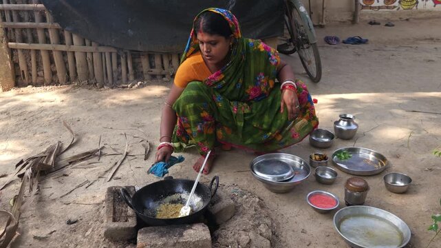 Rural Indian Woman Cooking Outdoors in Traditional Village Kitchen, Preparing Food on Wood Fire Chulha, Authentic Indian Lifestyle, Culture and Rural Life