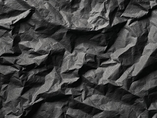 Crumpled Black Paper Surface with Visible Creases and Textures