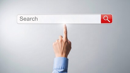 Close-up of a hand pointing at a digital search bar with a red search button on a plain gray background for technology and internet search concepts