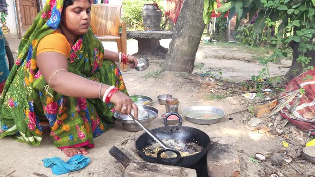 Rural Indian Woman Cooking Outdoors in Traditional Village Kitchen, Preparing Food on Wood Fire Chulha, Authentic Indian Lifestyle, Culture and Rural Life