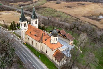 Petrovaradin, Serbia - January 02, 2026: Church of the Snow Lady on Tekija, Serbia. The church is a typical Roman Catholic church. Church photographed from a drone