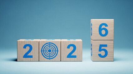 Wooden blocks displaying 2022 and 2025 with target symbol