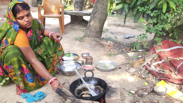 Rural Indian Woman Cooking Outdoors in Traditional Village Kitchen, Preparing Food on Wood Fire Chulha, Authentic Indian Lifestyle, Culture and Rural Life