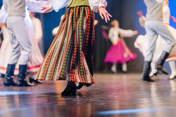 Colorful Latvian folk dance performance showcasing traditional attire and lively movement, capturing the essence of cultural celebration and artistry © Raivo
